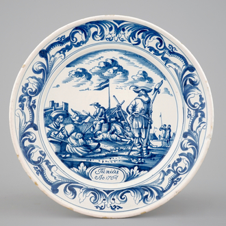 A blue and white plate with soldiers at camp, Makkum, Friesland, dated 1764