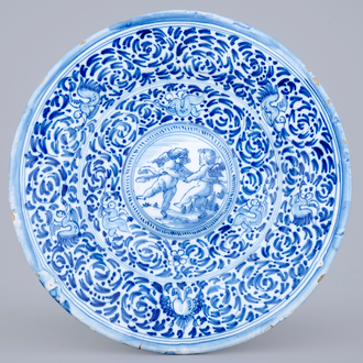 A blue and white cardinals dish with putti, Delft or Haarlem, 17th C.