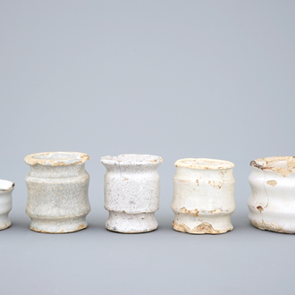 A set of five monochrome white Dutch Delft ointment jars, 17th C.