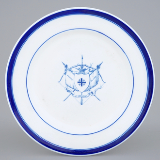 A Tournai porcelain plate with the arms of St.-Sebastian's Archers Guild in Ghent, 18th C.