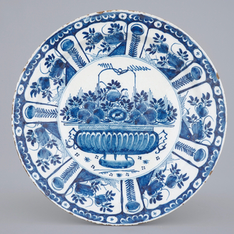 A blue and white Dutch Delft dish with a flower basket, early 18th C.