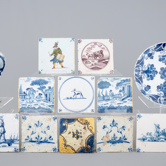 A Dutch Delft blue and white plate, a vase and a collection of tiles, 17/19th C.