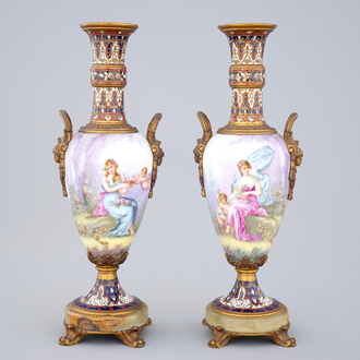 A pair of Sèvres porcelain vases with bronze and champleve enamel mounts, 19th C.