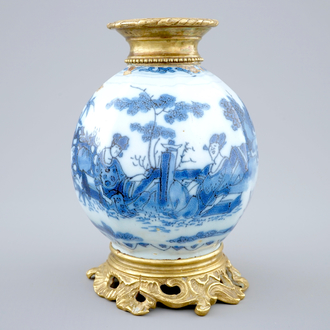 A Dutch Delft blue and white chinoiserie vase with bronze mounts, 17th C.