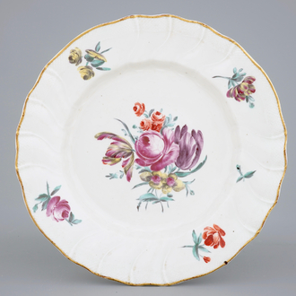 A polychrome Tournai porcelain plate with floral decoration, 18th C.