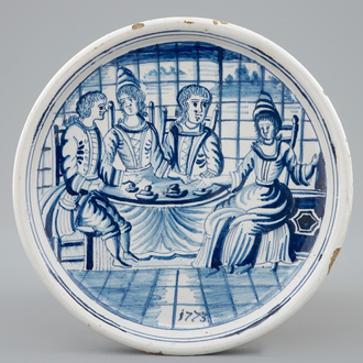 A dated blue and white salver with a tea drinking scene, Harlingen, Friesland, 1775