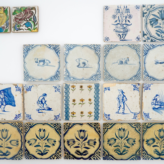 A set of 14 antique blue, white and polychrome Delft tiles, 17/19th C.