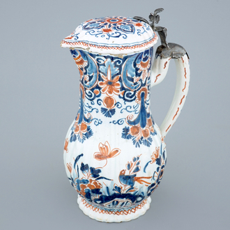 A polychrome Dutch Delft jug with cover, 18th C.