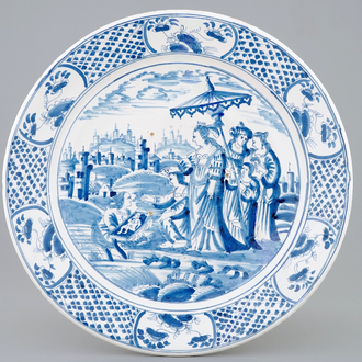 Un plat au décor religieux en majolique bleu et blanc de Harlingen, la Frise, 18ème