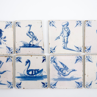 A set of 8 unusual blue and white Dutch Delft tiles, 18th C.