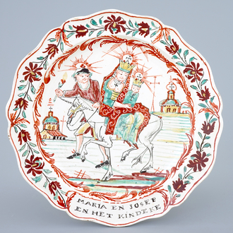 A Dutch-decorated Leeds creamware plate depicting "The flight into Egypt", 18th C.