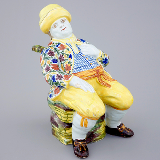 A polychrome Dutch Delft table fountain in the shape of a man, 18th C.