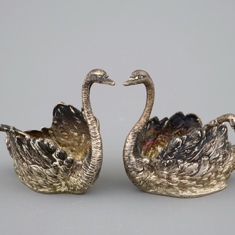 Two silver salts modelled as swans, with spoons