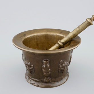 A bronze mortar with applied lion's heads, incl. its pestle, late 16th C.