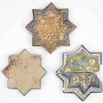 Three Kashan star shaped tiles, Central Persia, 13/14th C.