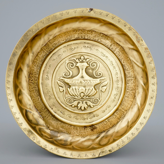 A Nuremberg brass alms bowl depicting a flowervase, 15/16th C.
