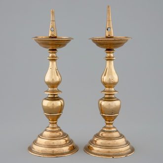 A pair of bronze pricket candle sticks, early 17th C.
