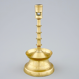 A copper alloy candle stick, The Low Countries, late 15th C.