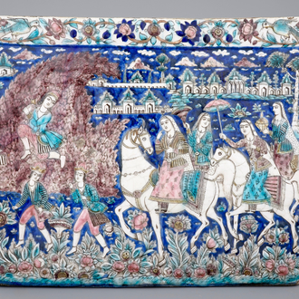 A large rectangular relief-moulded Qajar tile, Iran, early 19th C.