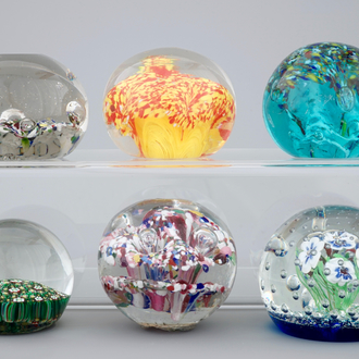 A set of six glass paperweights, 20th C.