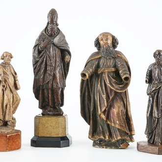 A lot of 4 carved wood figures of saints, 16/18th C.