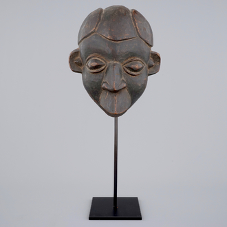 An African carved wooden mask, Bamum, Cameroon