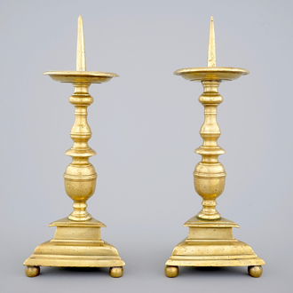 A pair of bronze pricket candle sticks, 17th C.