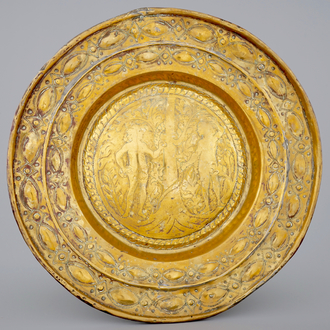 A large Flemish brass alms dish with Adam and Eve, Mechelen, 17e eeuw