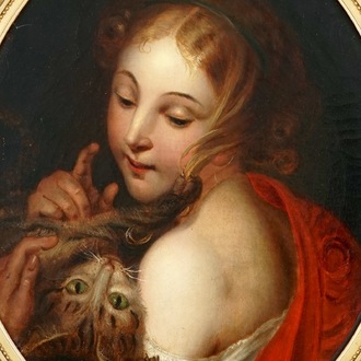 A portrait of a young lady with a kitten, oil on canvas in a gilt oval frame, 19th C.