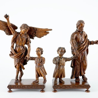Deux groupes en bois sculpté au sujets de Joseph et l'archange Michael, avec enfant, sur base, 18ème