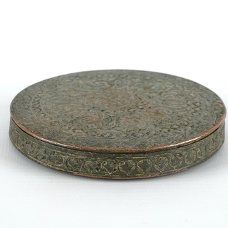 A round engraved tinned brass mirror box, Central Persia, 18/19th C.