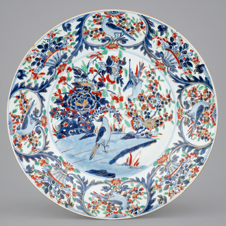 A large clobbered Chinese blue and white dish, Kangxi