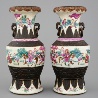 A mirrored pair of Chinese famille rose Nanking vases, 19th C.