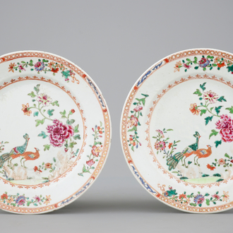 A pair of Chinese famille rose plates with peacocks, 18th C.