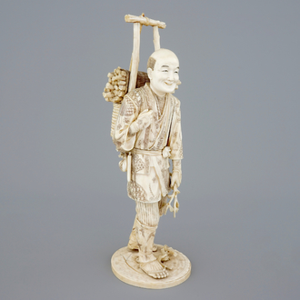 A Japanese carved ivory figure of a lumberjack, Meiji, 19th C.