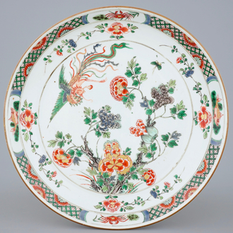 A fine Chinese famille verte dish with a flying fenghuang, Kangxi