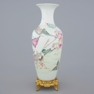 A Chinese famille rose vase on a gilt bronze stand, 18/19th C.