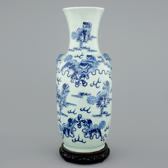 A fine Chinese blue and white on celadon ground porcelain vase with foo dogs, 19th C.