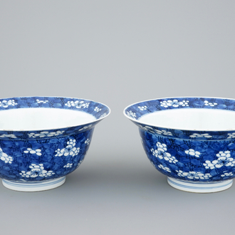 A pair of Chinese blue and white "Prunus on ice" klapmuts bowls, Kangxi