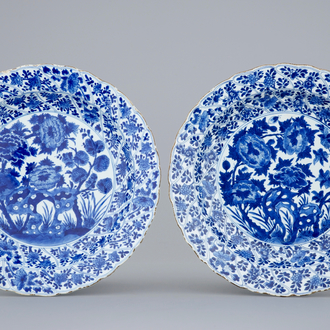 A pair of moulded blue and white Chinese peony & rockwork dishes, Kangxi