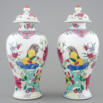 A pair of Chinese famille rose rooster vases and covers, 18/19th C.