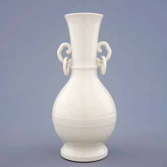 A monochrome blanc de Chine Dehua vase with underglaze design, Kangxi