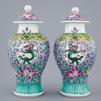A pair of Chinese famille rose vases and covers, 19/20th C.