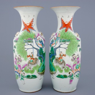 A pair of Chinese famille roses vases with boys on oxes, 19/20th C.
