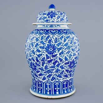 A Chinese blue and white vase and cover with lotus scrolls, 19th C.