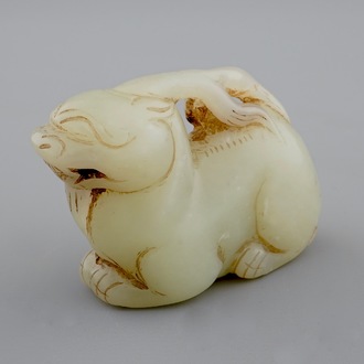 A Chinese celadon carving of an archaic deer, 18/19th C.