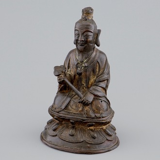 A Chinese bronze figure of a sage holding a ruyi sceptre, Ming Dynasty