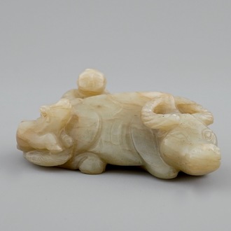 A Chinese jade group of a boy on a buffalo, 18/19th C.