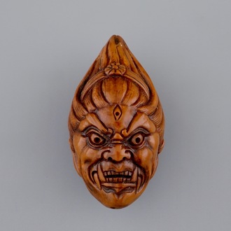A Chinese carved walnut, signed, 20th C.