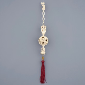 A hanging Chinese ivory puzzle ball, Canton, 19th C.